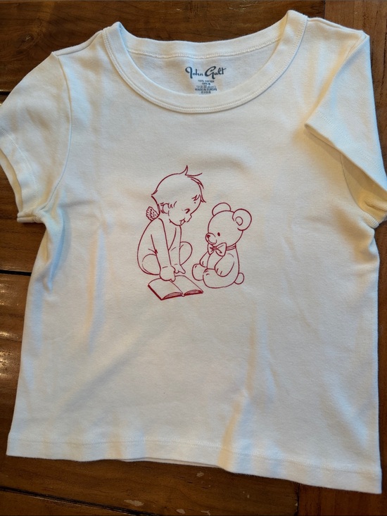 Brandy Melville Tops - John Galt / Brandy Melville White Tee with Red Storytime Graphic